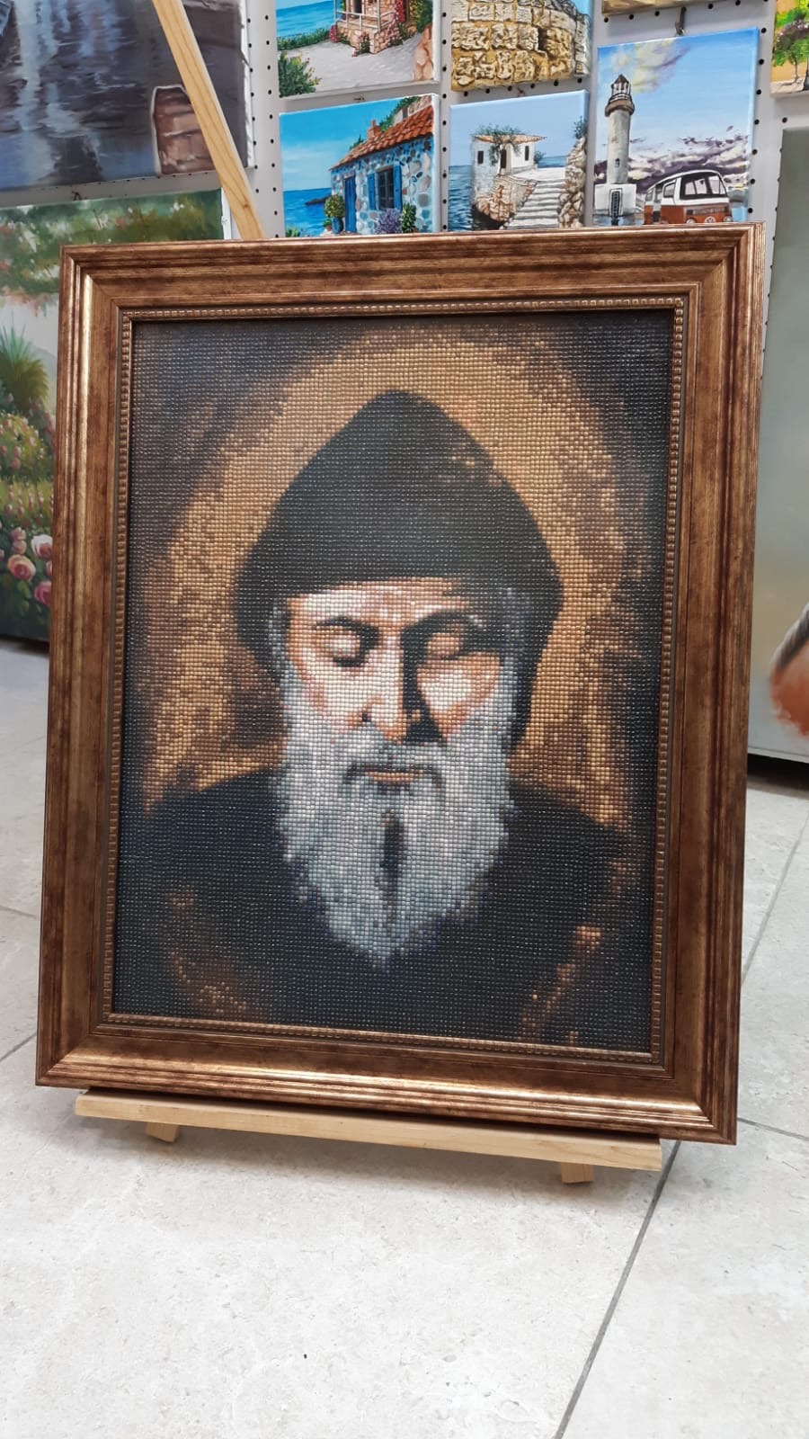 Finished framed diamond painting on an easel
